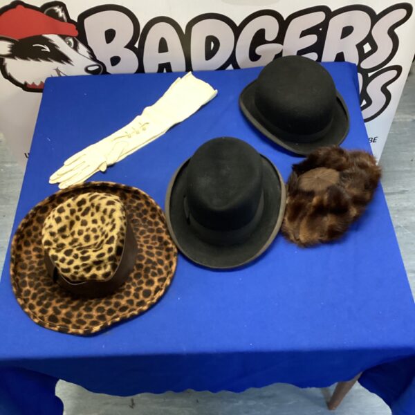 Pair of vintage bowler hats on display, classic gentleman's headwear.
