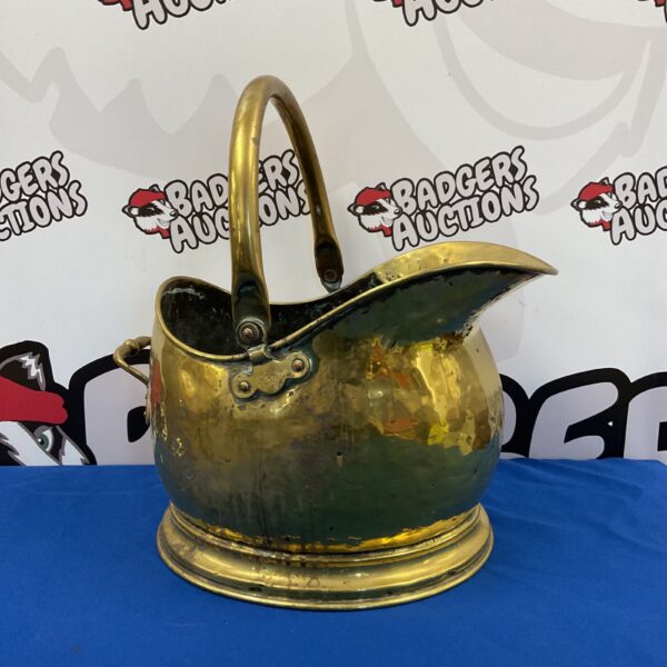 Vintage brass helmet coal scuttle for fireplace use.