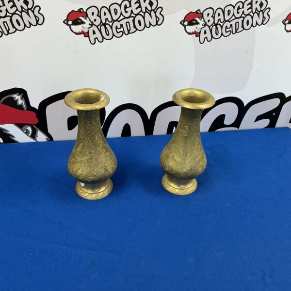 Pair of vintage brass Persian vases with intricate engraving.
