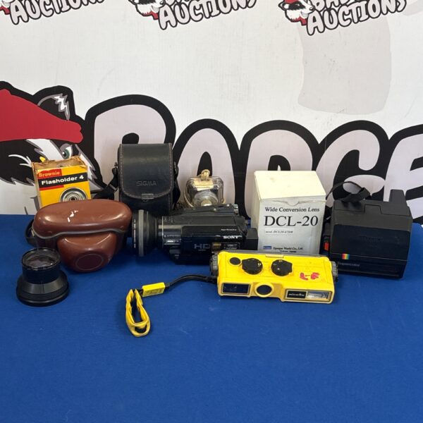 Vintage camera lot including Polaroid and Sony cameras with accessories.