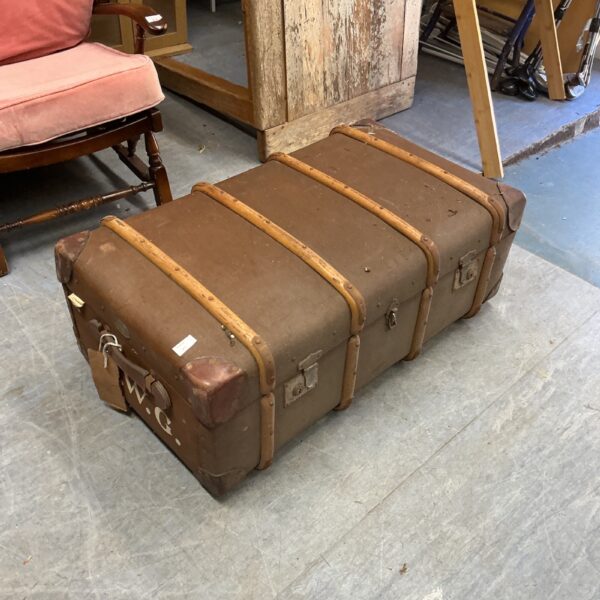 Vintage canvas storage chest with leather detailing, ideal for collectors.