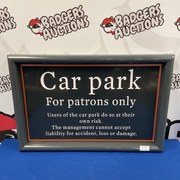 Vintage metal car park sign for patrons.