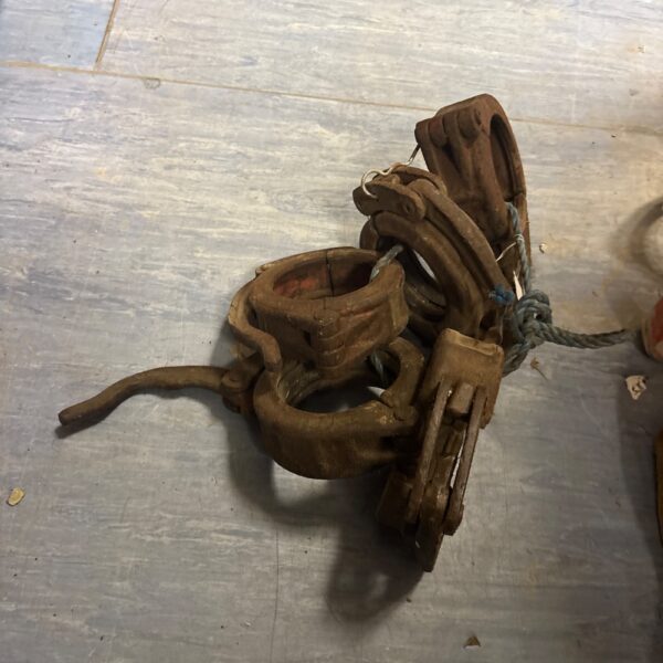 Vintage cast iron pipe clamp for plumbing or industrial use.