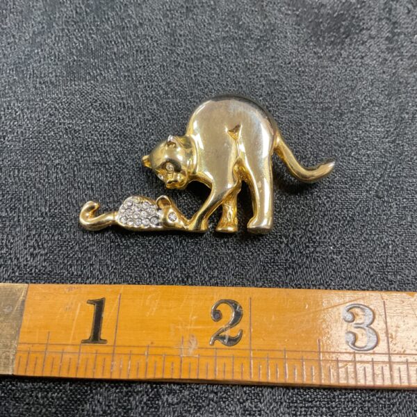 Vintage gold tone cat and mouse brooch, detailed animal jewellery.