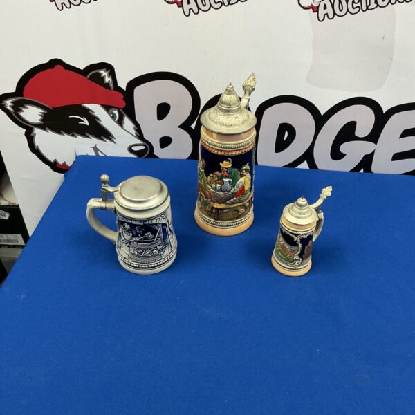 Vintage ceramic beer steins collection for display or collecting.