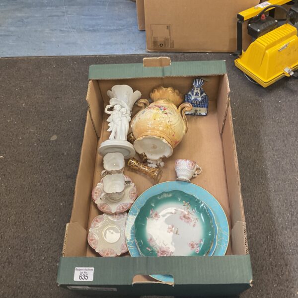 Vintage ceramic collection with porcelain figurines and vases.