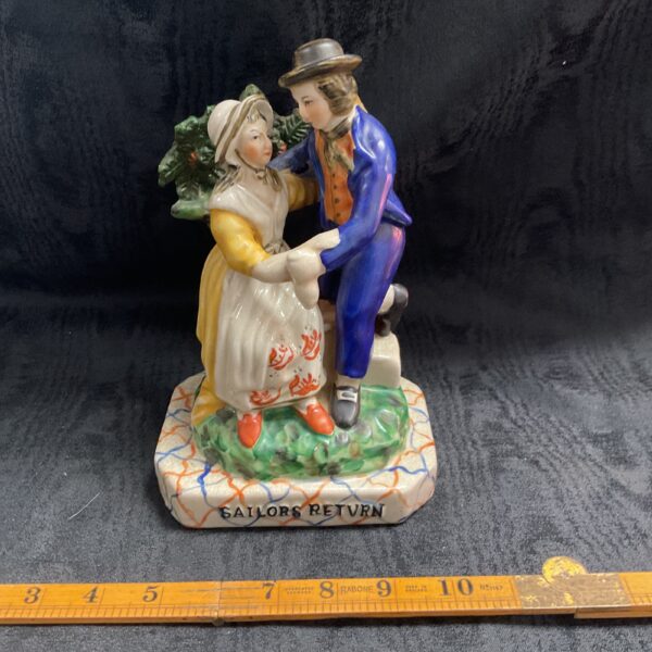 Vintage ceramic sailor return figure, nautical home decor collectible.