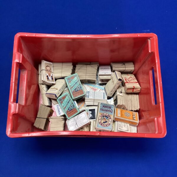 Vintage cigarette cards from Players Navy Cut and Park Drive in a red tub.