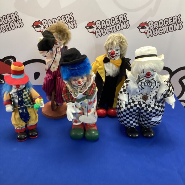 Lot of five vintage clockwork ceramic clowns.
