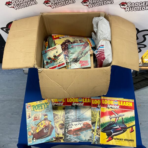 Vintage comic book lot including Popeye and Commando comics.
