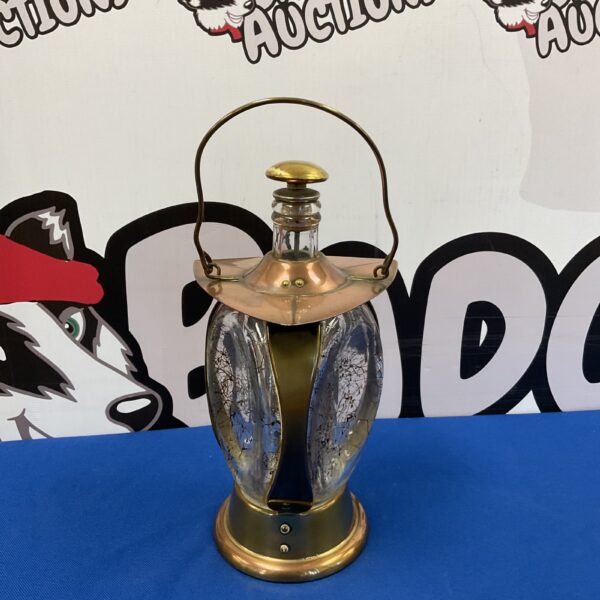 Vintage copper bottle lantern with patterned glass.