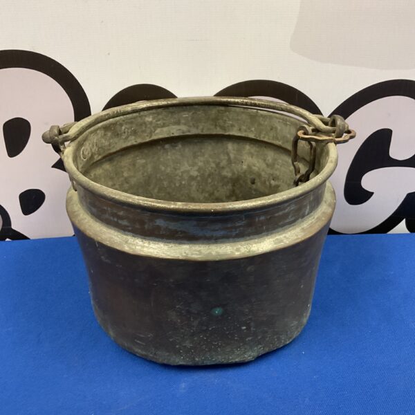 Vintage copper cauldron with handle, rustic farmhouse style.