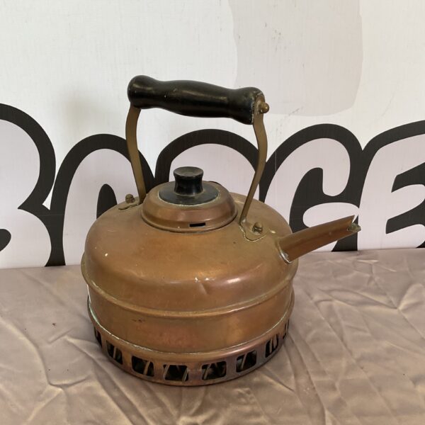 Vintage copper kettle with patina and handle.