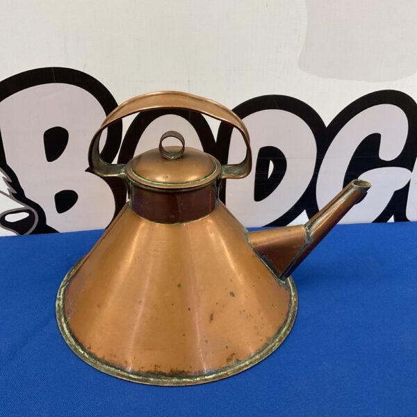 Vintage copper kettle with patina, ideal for collectors.