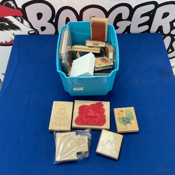 Vintage craft stamp blocks with wooden handles and patterned designs.