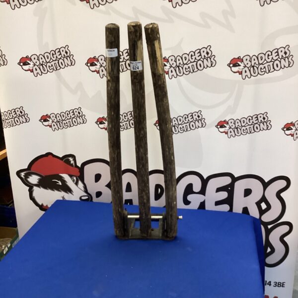 Set of three vintage wooden cricket stumps for collectors.
