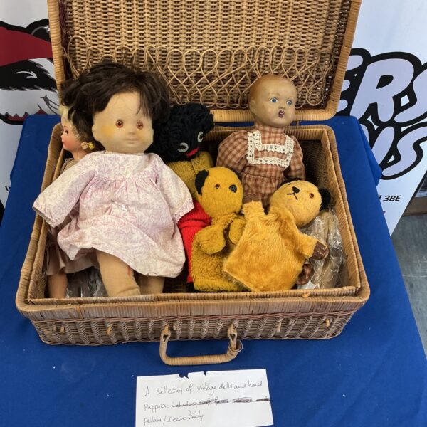 Basket of vintage dolls and puppets including Deans Sooty.