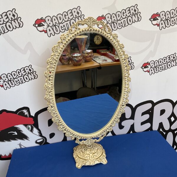 Ornate vintage dressing table mirror with cast iron frame.