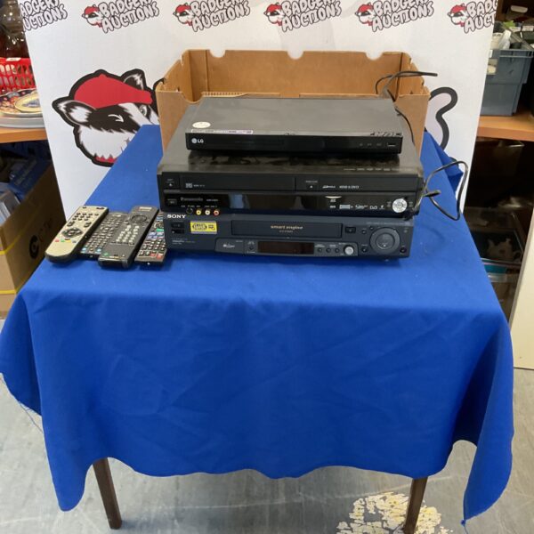 Vintage lot of DVD players, CD players, and cassette recorders with remotes.