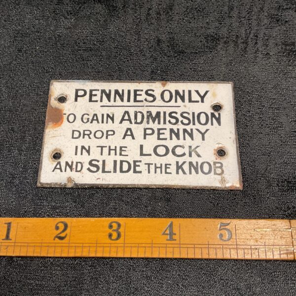 Vintage enamel sign displaying "Pennies Only" admission cost.