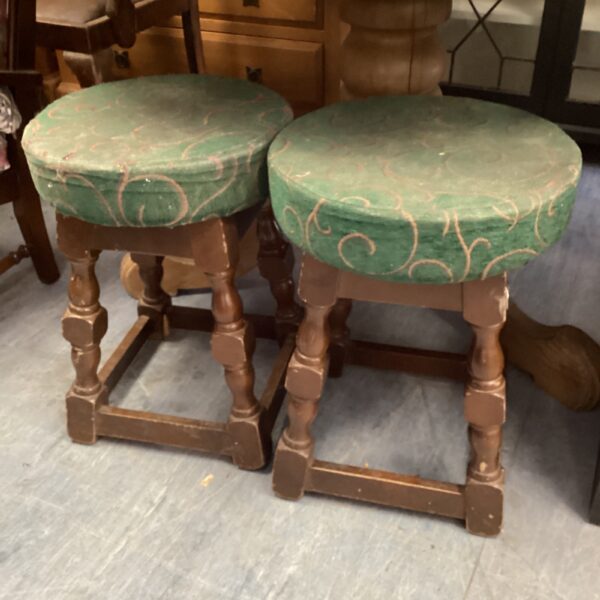 Pair of vintage farmhouse stools with upholstered seats.