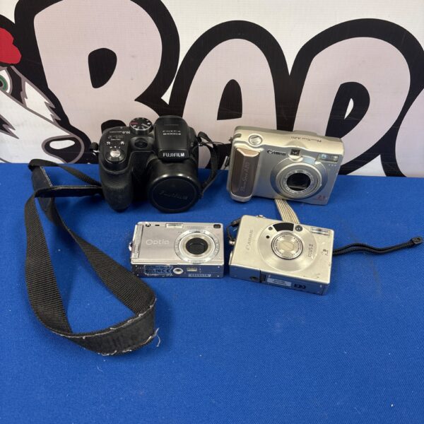 Vintage film camera lot including Fuji Film and Canon models.