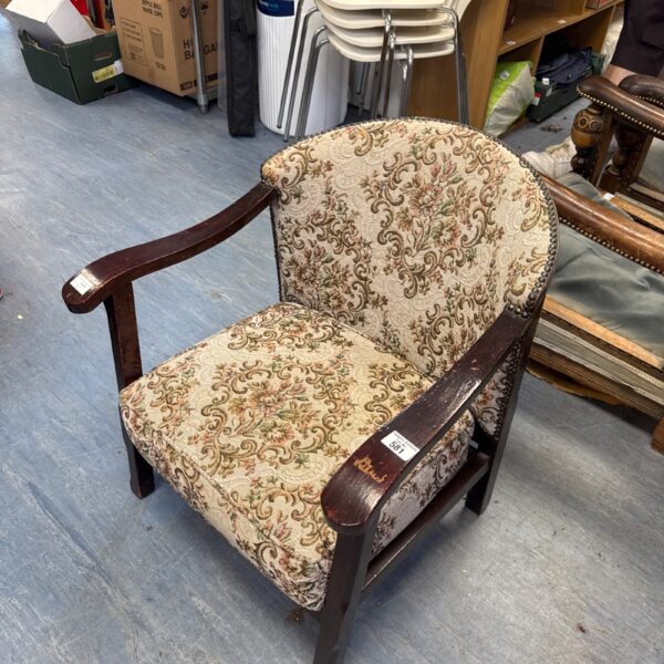 Vintage floral nursing chair with studded detailing.