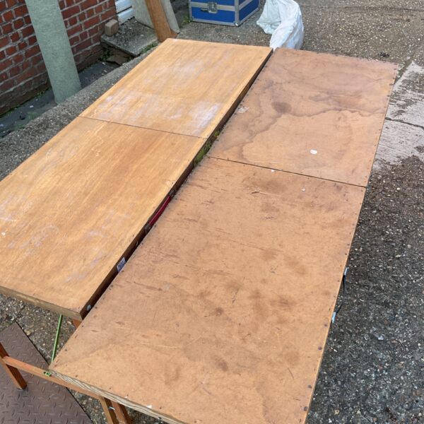 Vintage wooden folding pasting tables for crafting and sewing.