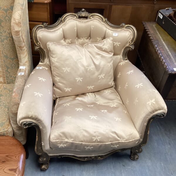 Elegant vintage French Bergere armchair with button-back upholstery.