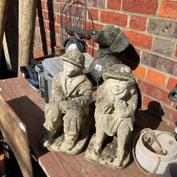Vintage garden ornaments, a gentleman and lady statue pair.