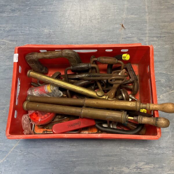 Tray of vintage garden tools including sprayers and hand drill.
