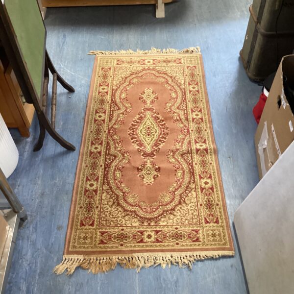 Vintage geometric runner rug with warm tones and patterned design.
