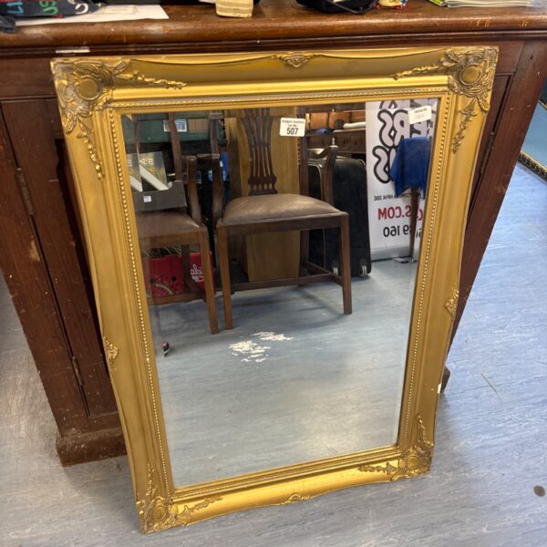 Large vintage gilt framed bevelled glass mirror for wall decor.