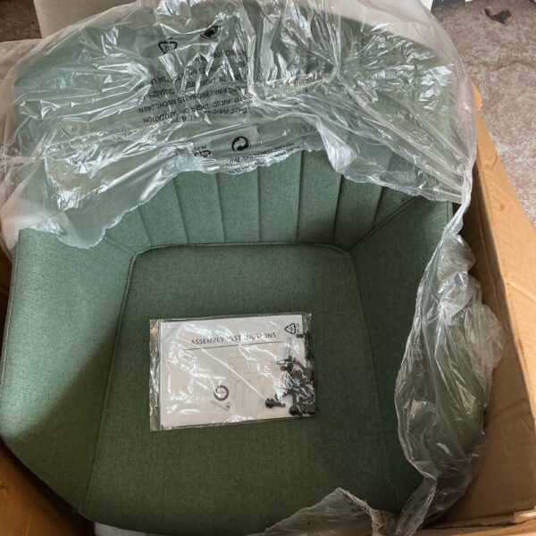 Pair of vintage green chairs still in original packaging.