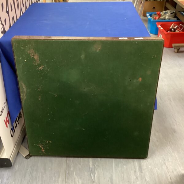 Vintage green folding card table for games and small spaces.