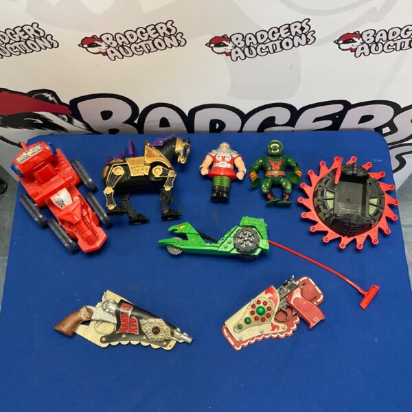 Vintage He-Man toys and cap guns lot for collectors.