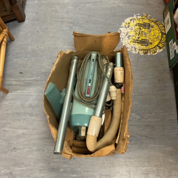 Vintage Hooverette Model 2944 stick vacuum cleaner in box.