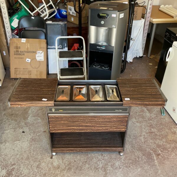 Vintage Hostess Royal trolley with faux woodgrain surface.