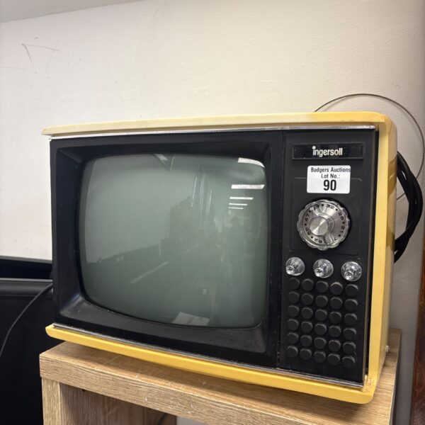 Vintage Ingersoll XK120 television in warm tones.