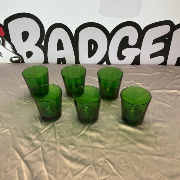 Six vintage Italian green glasses displayed together.