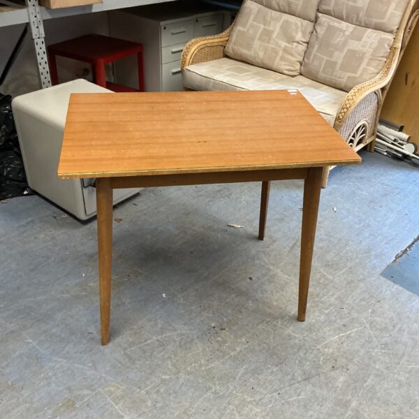 Vintage wood kitchen table with tapered legs.
