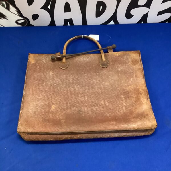 Vintage brown leather bag with a single handle.