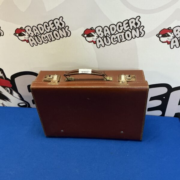 Front view of a vintage leather suitcase.