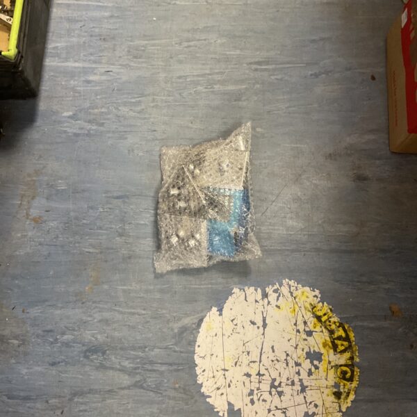 Vintage light switches in a plastic bag, ideal for restoration.