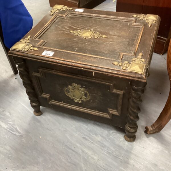 Vintage log box with turned legs, ideal for farmhouse style.