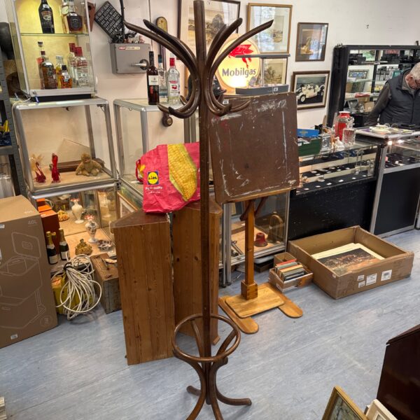 Vintage mahogany coat stand with curved arms and tripod base.