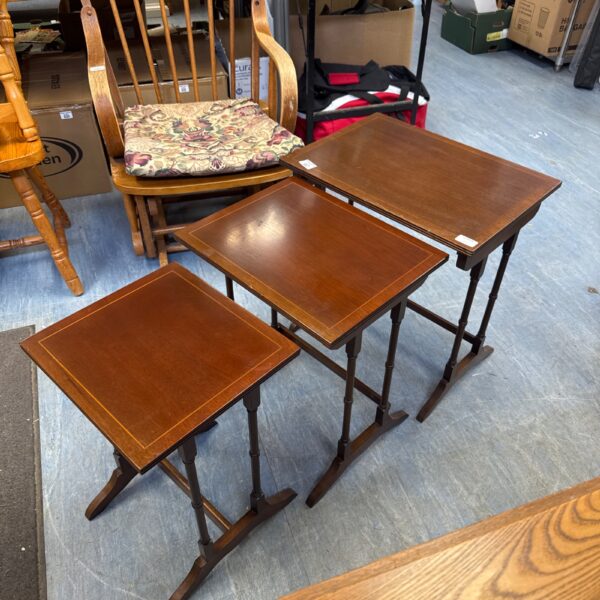 Vintage mahogany nest of tables for restoration, classic mid-century style.