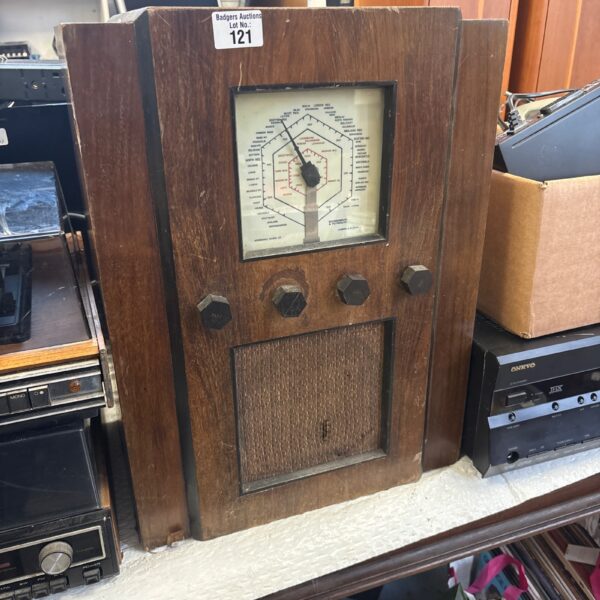 Vintage McMichael valve radio from the 1930s in wooden cabinet.