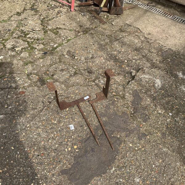 Pair of vintage metal boot scrapers for cleaning footwear.