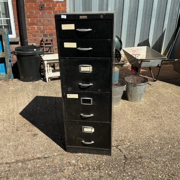 Vintage five-drawer metal filing cabinet with aged patina.